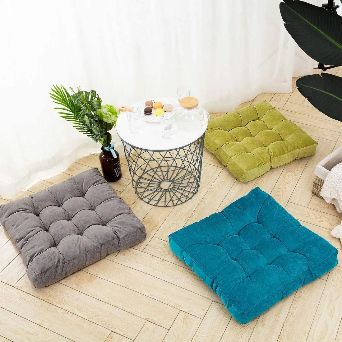 Un espace de détente à trois avec comme siège trois coussins multi tâches